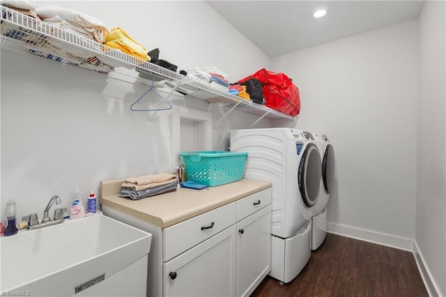 254 Kilbourne Dr, Advance, NC 27006 - washroom featuring washer and clothes dryer, dark wood-type flooring, recessed lighting, and cabinet space