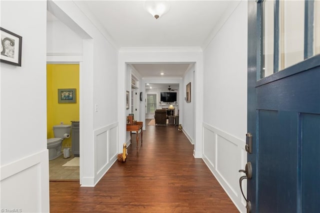 254 Kilbourne Dr, Advance, NC 27006 - entrance foyer with dark wood-type flooring, a decorative wall, crown molding, and wainscoting