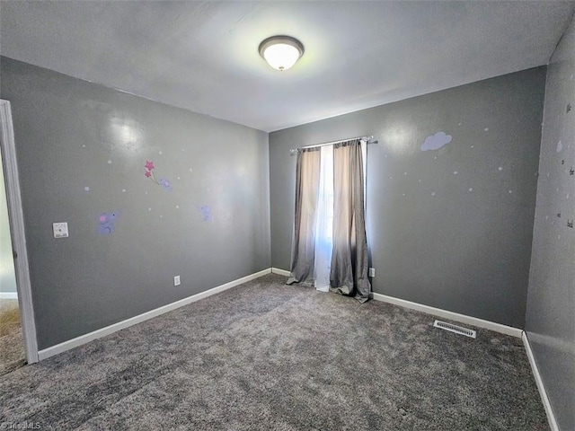 empty room with carpet flooring