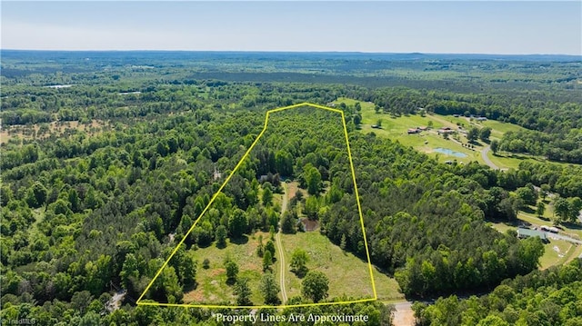 aerial view featuring a forest view