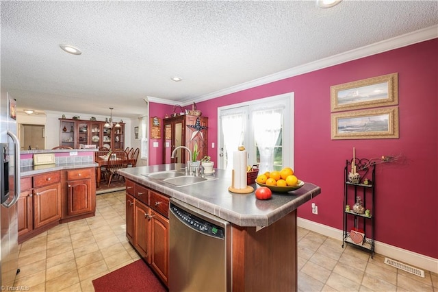 kitchen featuring a sink, dishwasher, a kitchen island with sink, a textured ceiling, and visible vents