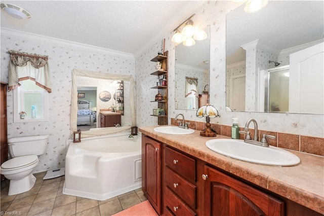 bathroom with a sink, ornamental molding, a stall shower, and wallpapered walls