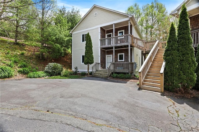 196 Evergreen Springs Ct Unit 602, Blowing Rock, NC 28605 - back of house with a balcony, stairs, and a porch