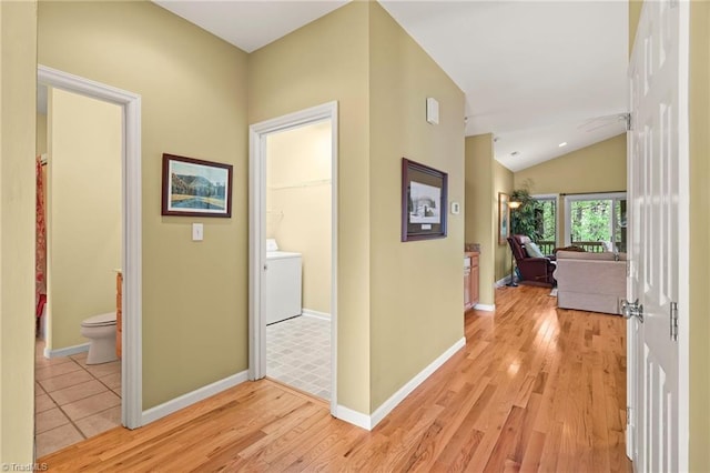 196 Evergreen Springs Ct Unit 602, Blowing Rock, NC 28605 - hallway with washer / clothes dryer, light wood finished floors, vaulted ceiling, and baseboards