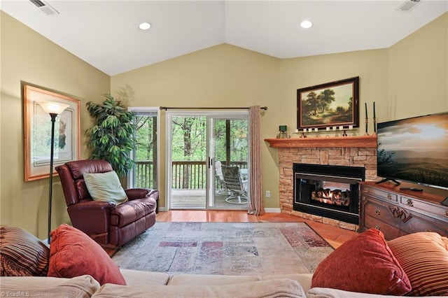 196 Evergreen Springs Ct Unit 602, Blowing Rock, NC 28605 - living room with vaulted ceiling, a stone fireplace, recessed lighting, and wood finished floors