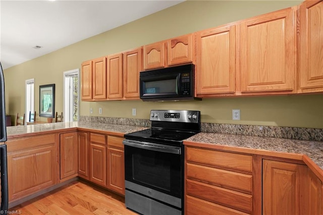 196 Evergreen Springs Ct Unit 602, Blowing Rock, NC 28605 - kitchen with black microwave, stainless steel electric stove, tile counters, and light wood-type flooring