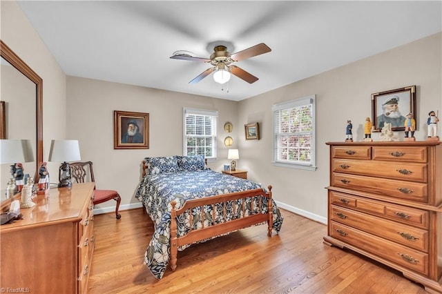 bedroom featuring light hardwood / wood-style floors and ceiling fan