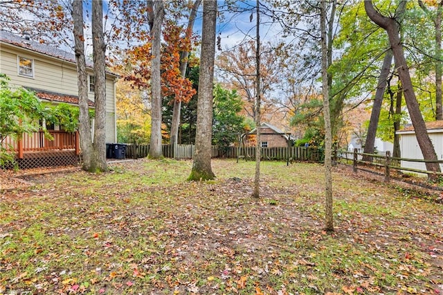 view of yard featuring a wooden deck