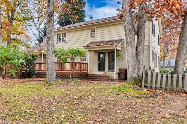 back of property featuring a deck