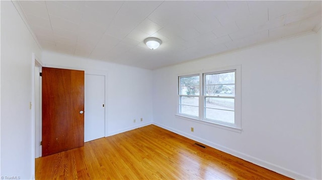 empty room with hardwood / wood-style floors