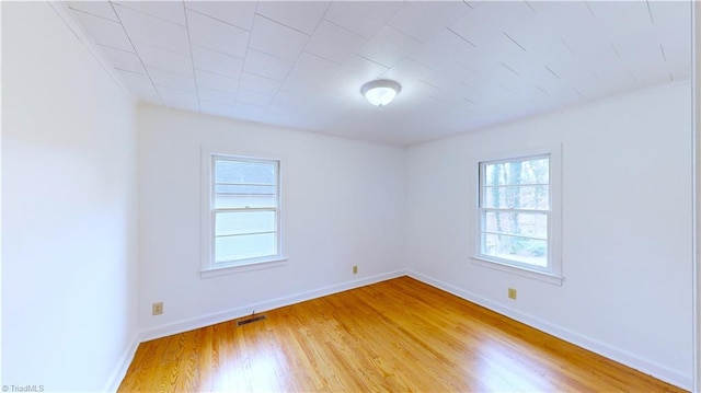 unfurnished room with light hardwood / wood-style floors