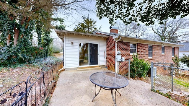 rear view of property featuring a patio area