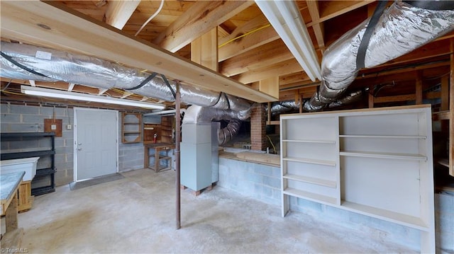 basement featuring heating unit