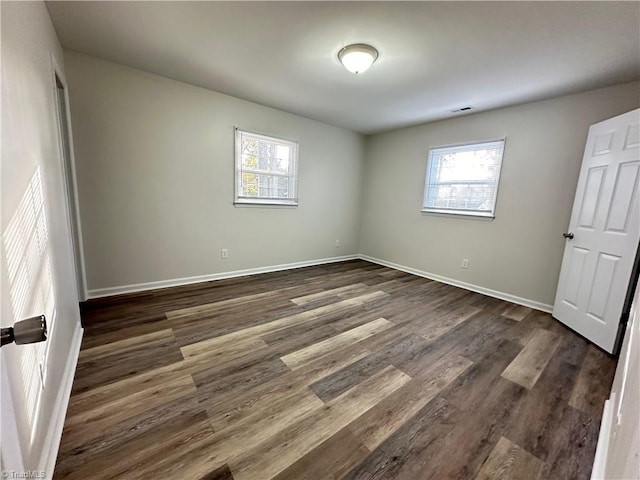 empty room featuring dark hardwood / wood-style floors