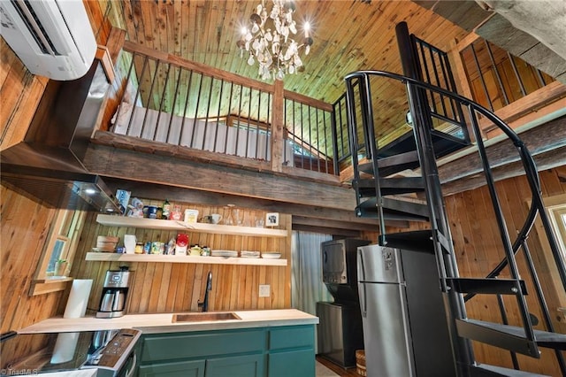 bar featuring range with electric stovetop, freestanding refrigerator, a sink, and wood walls