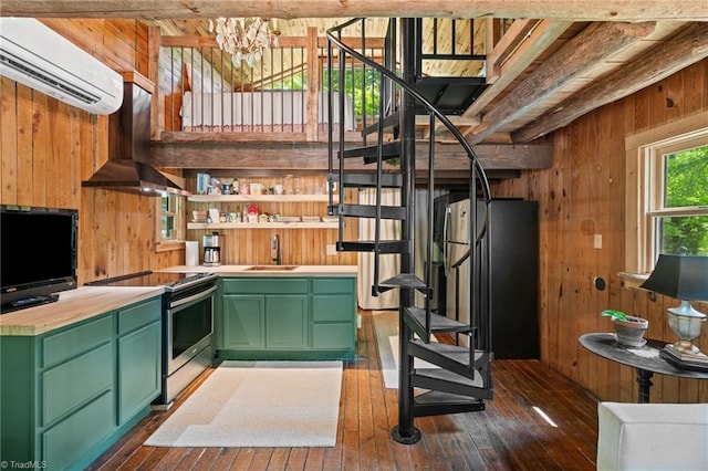 bar with stairs, wooden walls, range hood, stainless steel electric stove, and a sink