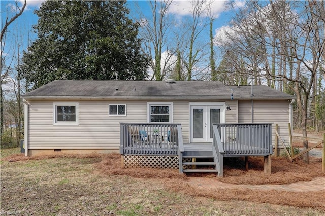 rear view of property with a deck, french doors, and crawl space