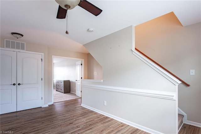 bonus room featuring lofted ceiling, hardwood / wood-style floors, and ceiling fan