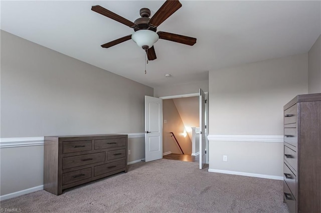 unfurnished bedroom with ceiling fan and light carpet