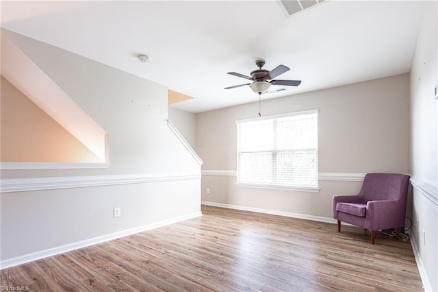 unfurnished room featuring ceiling fan and light hardwood / wood-style floors