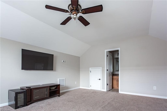 unfurnished living room with ceiling fan, lofted ceiling, and light colored carpet