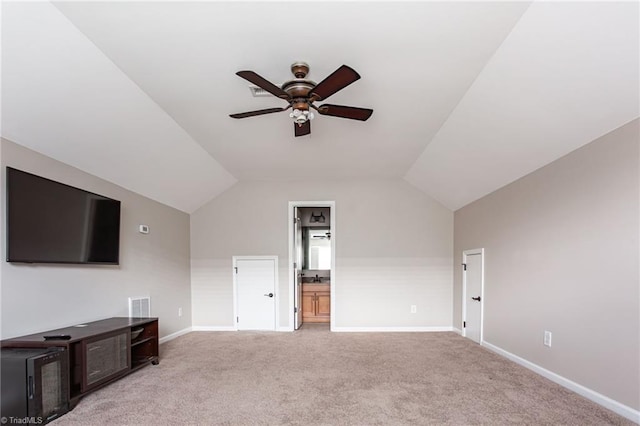 interior space with ceiling fan, light carpet, and lofted ceiling