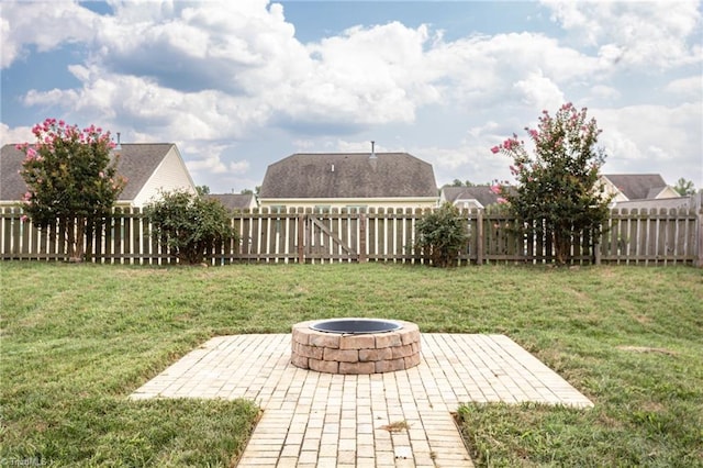 view of yard with a patio area and an outdoor fire pit