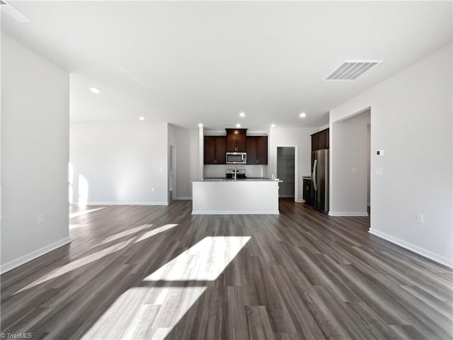 unfurnished living room with dark hardwood / wood-style floors