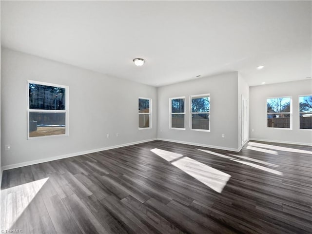 spare room featuring dark wood-type flooring