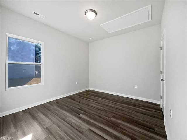 unfurnished room with dark hardwood / wood-style floors