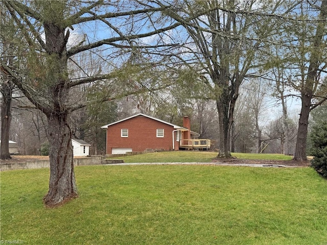 view of yard with a wooden deck