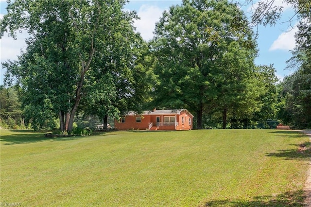 2765 Green Oaks Dr, Winston-Salem, NC 27107 - view of green lawn with a wooden deck