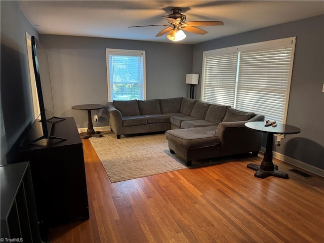 2765 Green Oaks Dr, Winston-Salem, NC 27107 - living room featuring a ceiling fan and wood finished floors