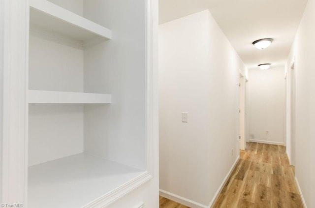 corridor featuring light hardwood / wood-style floors