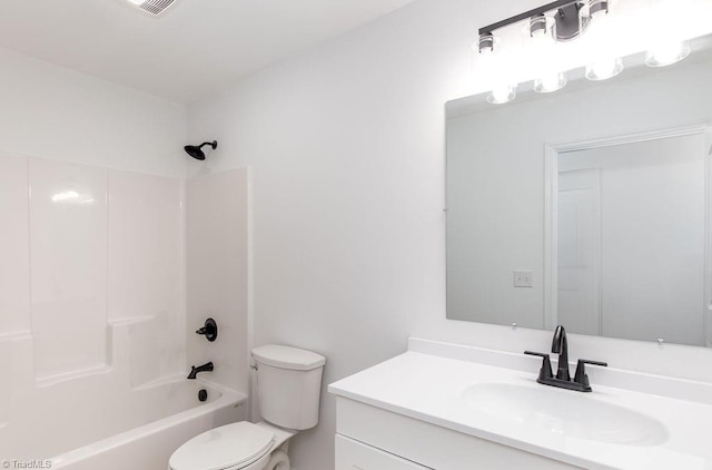 full bathroom featuring vanity, toilet, and  shower combination