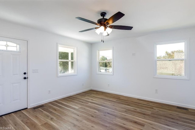 foyer entrance featuring ceiling fan, hardwood / wood-style flooring, and plenty of natural light