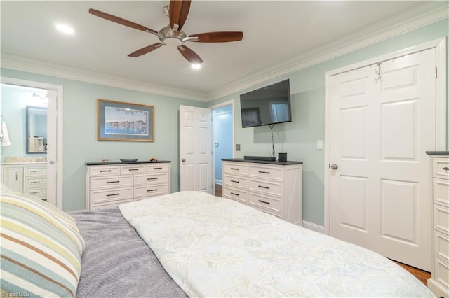 bedroom with connected bathroom, crown molding, baseboards, and ceiling fan