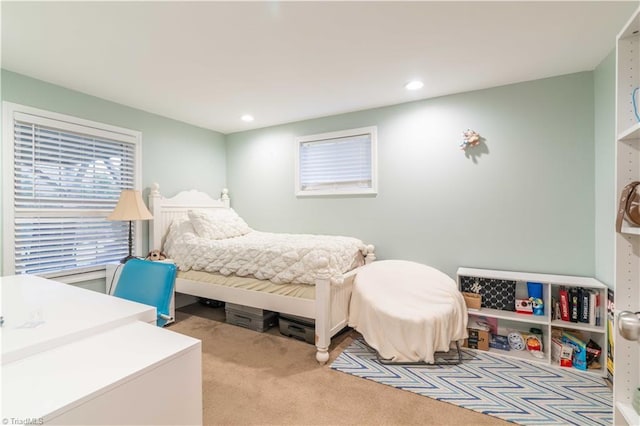 carpeted bedroom with recessed lighting