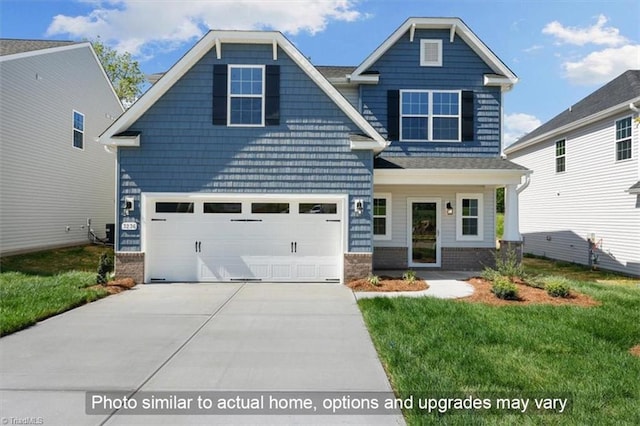 craftsman-style home featuring a garage and a front lawn