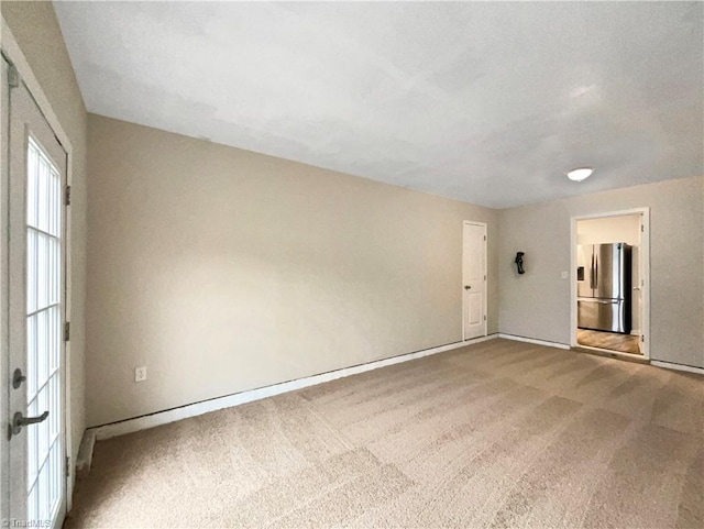 unfurnished room with carpet floors