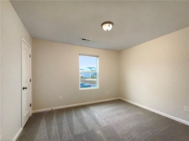 unfurnished room featuring carpet