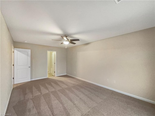 unfurnished room with ceiling fan and carpet floors