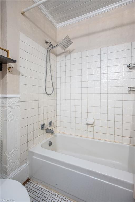 full bath featuring shower / bathing tub combination, toilet, ornamental molding, and tile patterned flooring