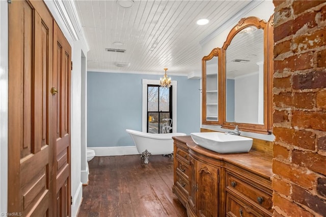 full bath with vanity, crown molding, a soaking tub, and wooden ceiling