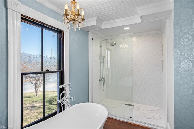 bathroom with wallpapered walls, crown molding, a notable chandelier, and a shower stall