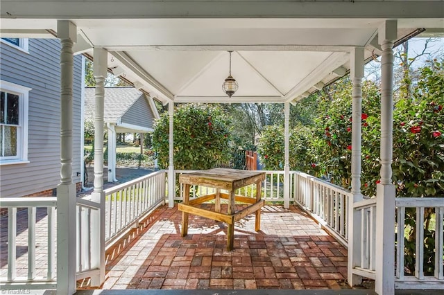 wooden terrace featuring covered porch