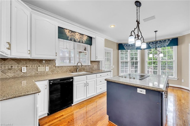 608 Greyrock Rd, Whitsett, NC 27377 - kitchen with black appliances, a sink, light wood-style floors, crown molding, and decorative backsplash