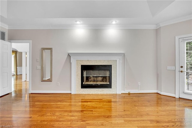 608 Greyrock Rd, Whitsett, NC 27377 - detailed view of ornamental molding, wood finished floors, a fireplace, and baseboards