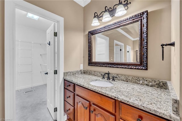 608 Greyrock Rd, Whitsett, NC 27377 - bathroom featuring vanity and ornamental molding
