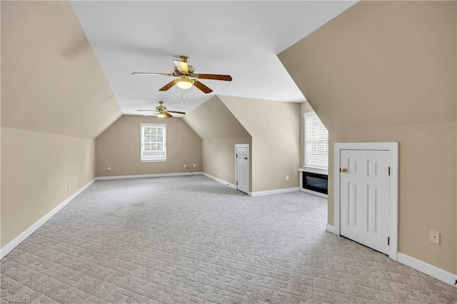 608 Greyrock Rd, Whitsett, NC 27377 - additional living space with carpet floors, a ceiling fan, baseboards, and vaulted ceiling